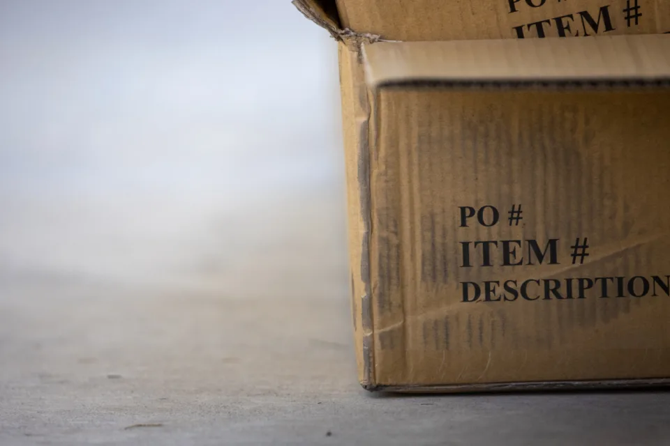 A carton marked PO and item number